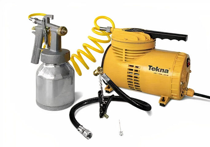 compressor amarelo com pistola de ar ao lado